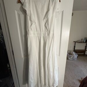 Sleeveless white dress with eyelet detailing